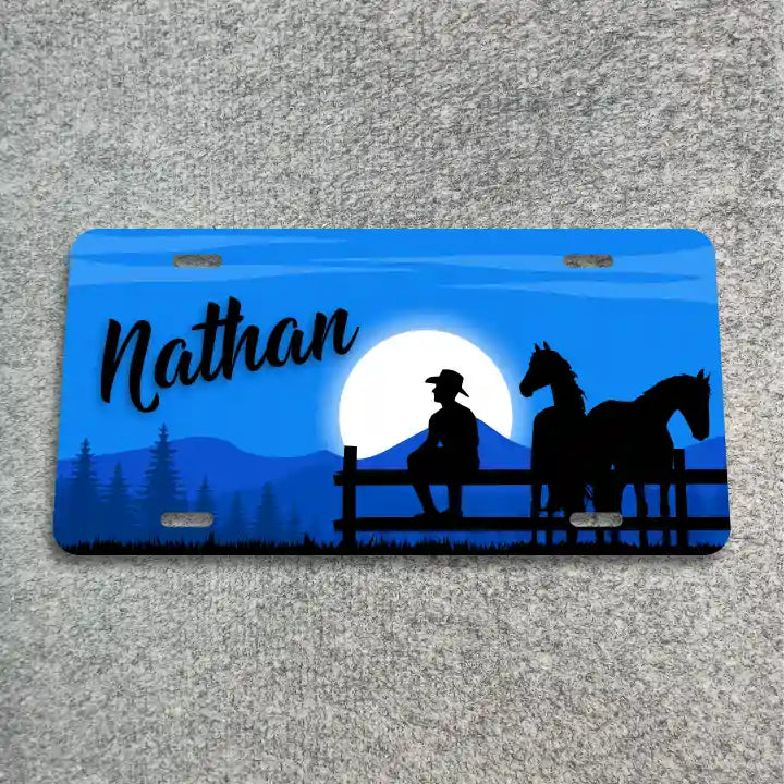 Cowboy on fence with horses License Plate CLP_278b