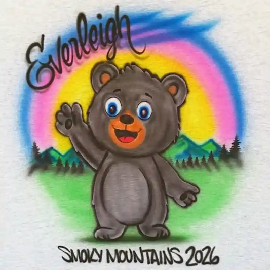 An airbrushed design featuring a cartoon black bear waving, with a colorful rainbow, green hills, pine trees, the name 'Everleigh' in black script, and 'SMOKY MOUNTAINS 2026' at the bottom.