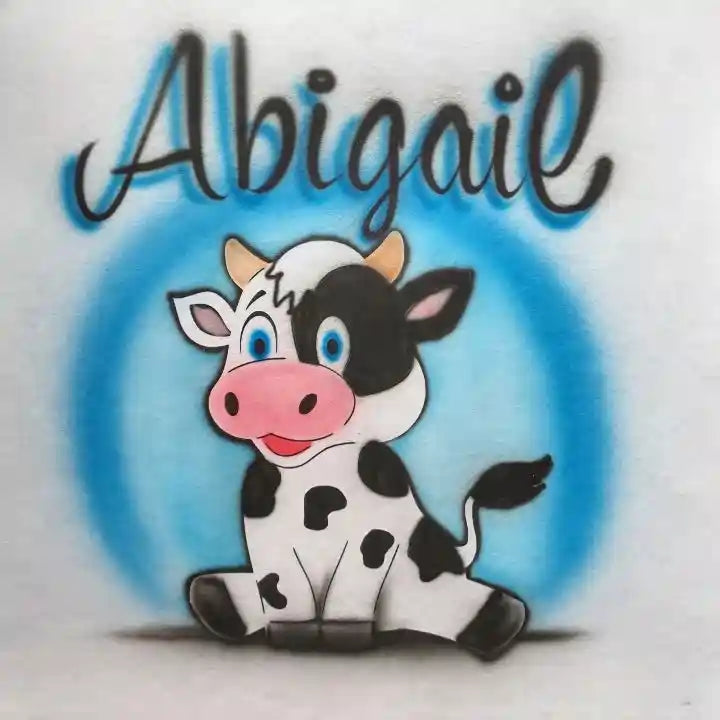 Cute cartoon cow with the name 'Abigail' written above it in black cursive with a blue shadow effect, set against a light blue circular background