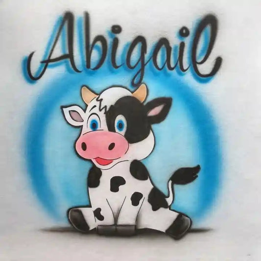 Cute cartoon cow with the name 'Abigail' written above it in black cursive with a blue shadow effect, set against a light blue circular background