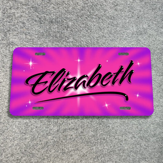 A license plate with a vibrant pink and purple sunburst design, featuring the name 'Elizabeth' in black cursive script with a white glow and star accents, displayed on a gray textured background.